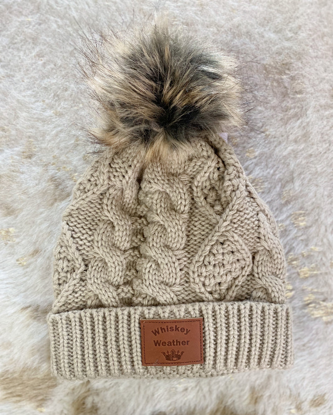 CRISP AND COZY CABLE KNIT HAT [TAN W/ WHISTKEY PATCH DETAIL]