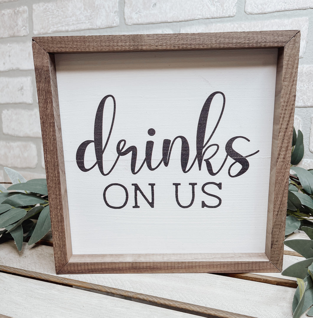 DRINKS ON US SIGN
